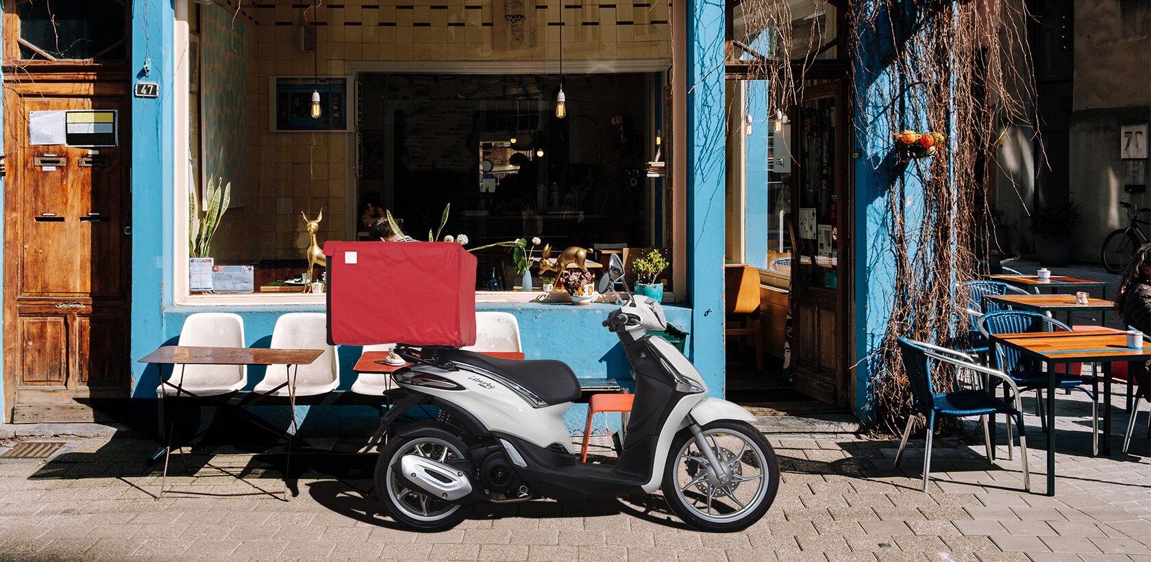 Deliverybike In Front Of Cafe Final Low